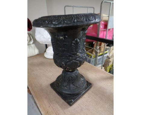 A painted concrete garden planter (black)