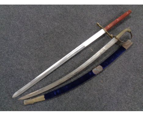 A reproduction Indian sword in scabbard and a Medieval style sword 