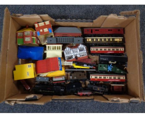 A box containing a quantity of Triang 00 scale rolling stock to include engines, tenders, coaches, wagons together with a qua