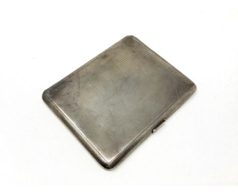 A silver cigarette case with engine turned decoration  CONDITION REPORT: 154g