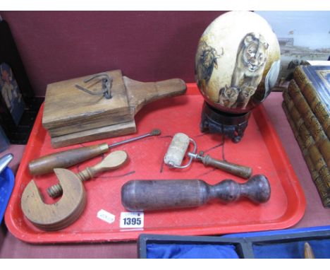  Ostrich Egg, on stand, wooden clapper, clamp, roller, pastry cutter, cosh.
