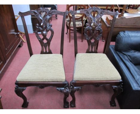 A Pair of Carved Hardwood Dining Chairs in The Chippendale Style.