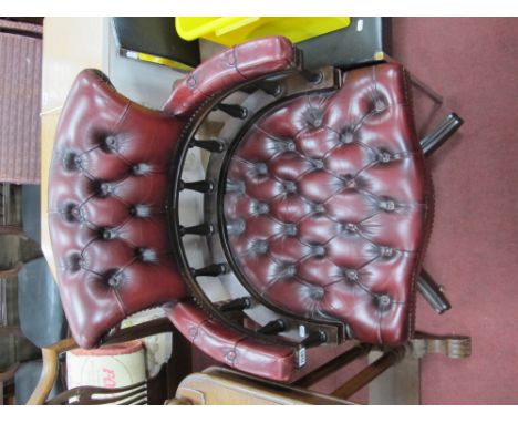 A XX Century Red Leather Swivel Office Chair, with button back, stud decoration, on a quarter foil base.