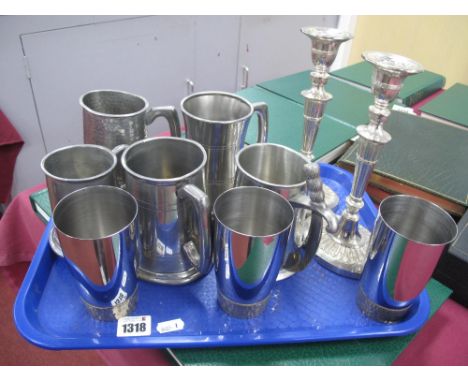 Three Stuart Devlin Stainless Steel Beakers, with gold plated bases, pewter tankards and pair of candlesticks:- One Tray.