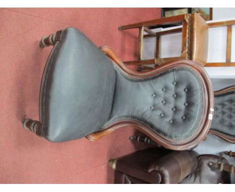 A XIX Century Mahogany Ladies Nursing Chair, with turned legs, re-upholstered in a black button back leather.