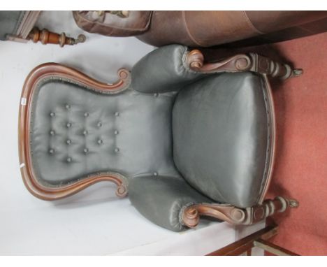 A XIX Century Mahogany Gent's Easy Nursing Chair, with scroll hand rests, re-upholstered in a black button black leather.
