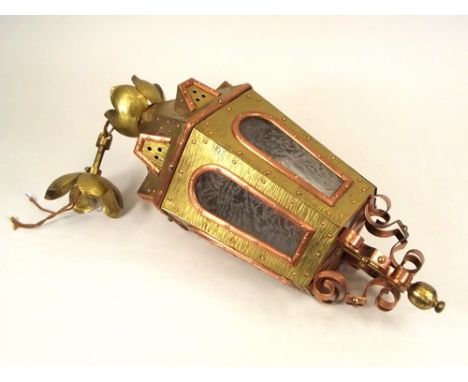 HALL LANTERN.
A Gothic style, hexagonal brass & copper hall lantern, with textured brass decoration & copper rivets. Length 6