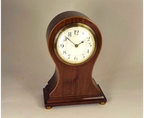 MANTEL CLOCK.
An Edwardian balloon shaped mahogany mantel clock, with French movement. Height 22cm.