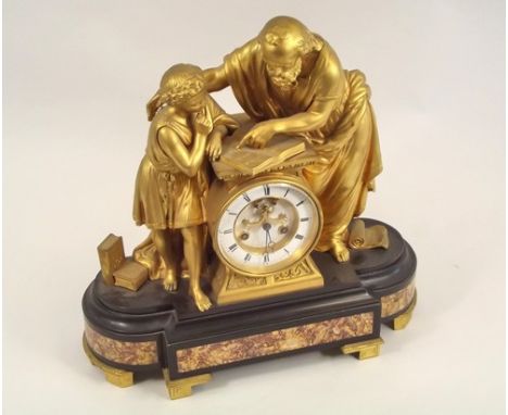 MANTEL CLOCK.
A 19th century French gilt metal figural mantel clock on slate & marble base, the movement stamped 'Medaille D'