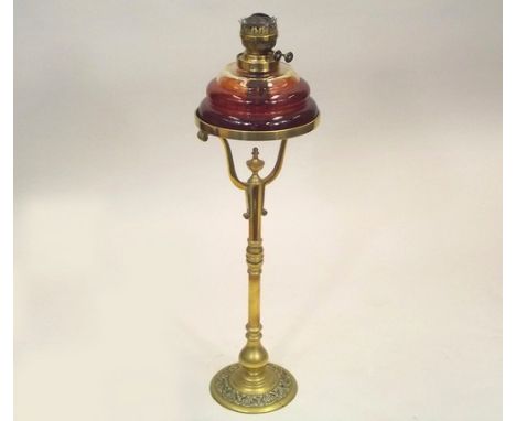 OIL LAMP.
A tall 19th century brass oil lamp with clear glass fount. Height 85cm.
PLEASE NOTE:  Our in-house, postal shipping