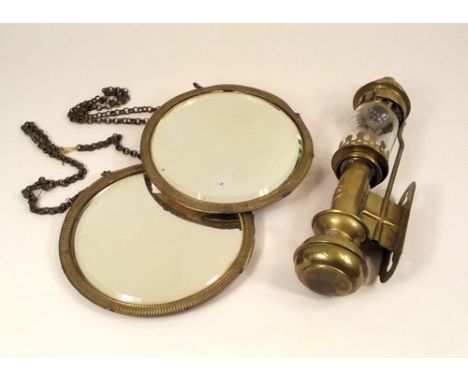 OIL LAMP & MIRRORS.
A brass mounted wall oil lamp, height 33cm & a pair of brass mounted circular mirrors, diameter 19cm.