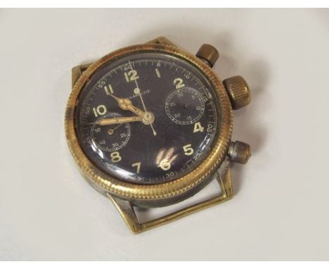 LUFTWAFFE PILOTS WRISTWATCH.
A WWII military Tutima Glashutte brass cased chronograph pilot's wristwatch, the black dial with