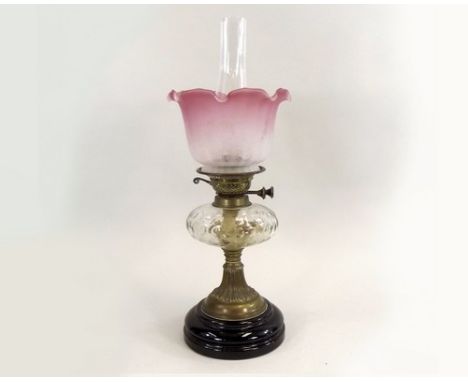 OIL LAMP.
A Victorian oil lamp with facet-cut glass fount & etched shade. Height 55cm.
PLEASE NOTE:  Our in-house, postal shi