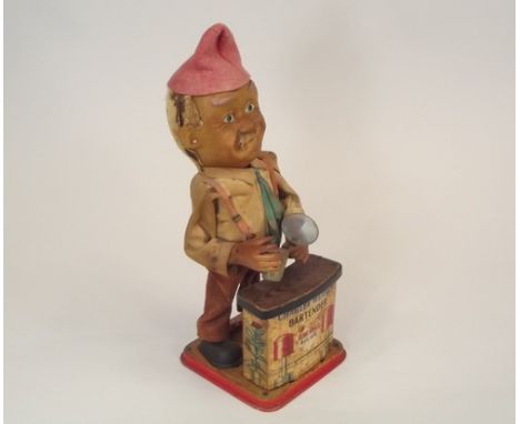 TIN PLATE CHARLEY WEAVER TOY.
A tin plate automaton Charley Weaver bartender toy.
Height 33cm.