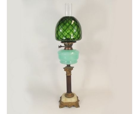 OIL LAMP.
A Victorian oil lamp with opaque glass fount & cast brass & marble Corinthian column. Height 74cm.
PLEASE NOTE:  Ou