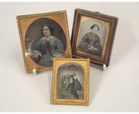 AMBROTYPES.
A 19th century tinted ambrotype portrait & two other ambrotypes. Largest 8 x 7cm. One with suspension ring.