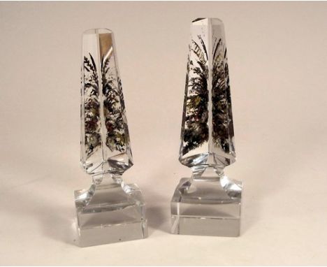 GLASS PRISMS.
A pair of glass prism obelisks with enamel decoration. Height 17cm. 