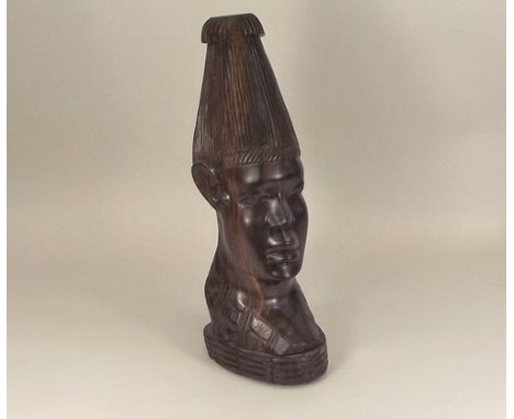 AFRICAN HEAD.
An African carved hardwood head, later drilled as a lamp base. Height 40cm.