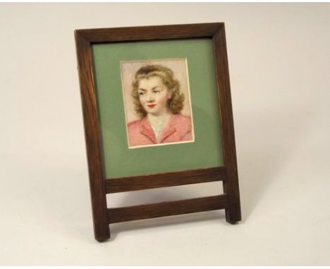 PORTRAIT MINIATURE.
A signed, hand painted portrait miniature of Elizabeth by Ada Godson. 7 x 6cm in oak strut frame.