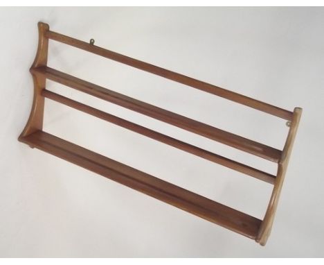 ERCOL PLATE RACK.
An Ercol light elm wall hanging plate rack. Height 50cm. Width 96cm.
PLEASE NOTE:  Our in-house, postal shi