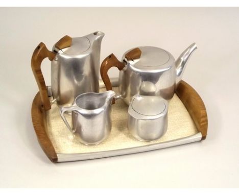 PICQUOT WARE.
A four piece Picquot Ware tea service with matching tray.