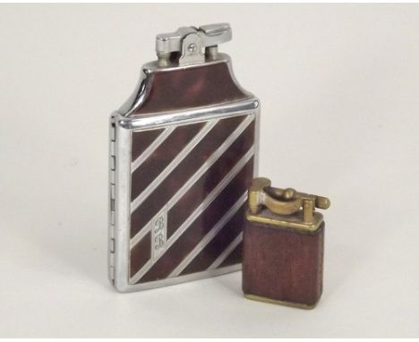LIGHTERS.
A Dunhill, brass & leather Jack Daniel's cigarette lighter & a Ronson combination cigarette lighter/case.
