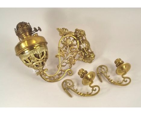 OIL LAMP ETC.
A cast brass oil lamp bracket, with brass fount & a pair of Victorian brass piano candle sconces.