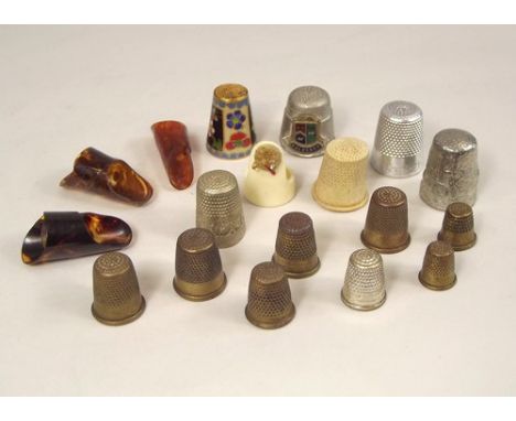 THIMBLES.
Various thimbles & finger guards in celluloid enamel, glass etc. 
