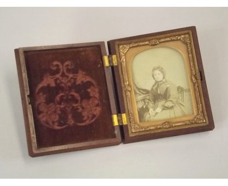 AMBROTYPES.
A 19th century ambrotype portrait of a seated lady. 6.5 x 5cm. Moulded Union-type case.