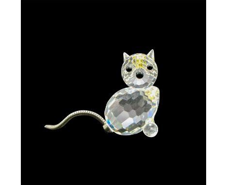 Clear, faceted body and face with black button eyes and nose. Silver coiled tail. Swarovski SCS backstamp. 7659031000. Artist