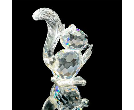 Part of the Woodland Friends series. Lead crystal rare figural squirrel holding a jet crystal nut, was only available in the 