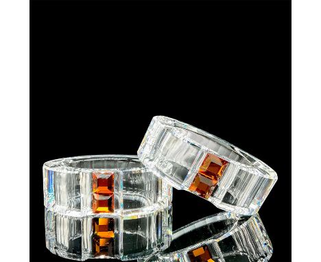 Part of the Crystal Decor collection and were called â€œRainbow". Lead crystal napkin rings with topaz accents in centre. Swa