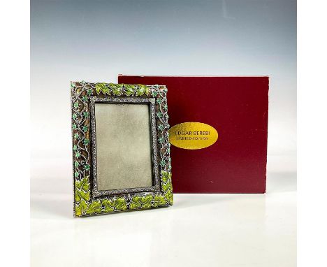 A beautiful silver plated vintage frame adorned with enameled green leaves, and violet, olivine, and peridot crystals. Edgar 