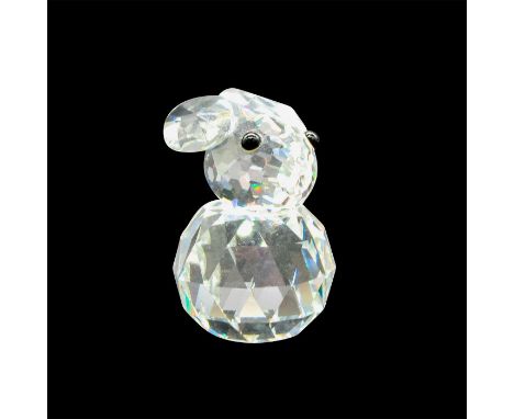 Clear, faceted body, head and tail with ears back. Black button eyes. Swarovski SCS backstamp. 7652 020 000. Artist: Max Schr