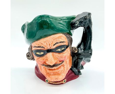 Style Two. Green tricorn, black mask over the eyes, red jacket.The first style of the Dick Turpin jug has the mask up on the 