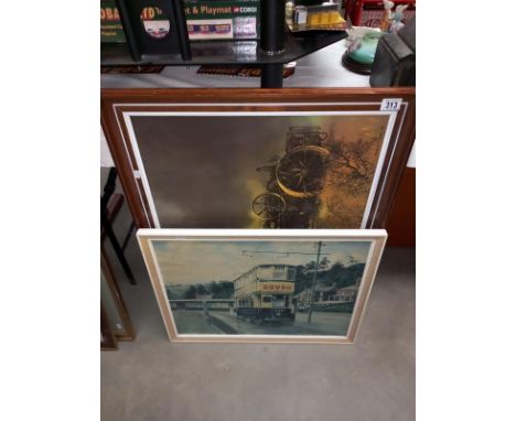 A large framed print on board of a steam engine and another of a tram.