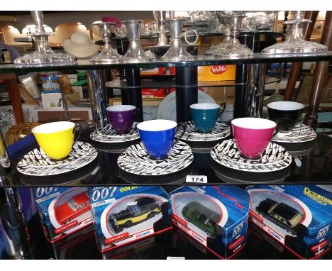 A set of 6 coloured Royal Albert South Pacific trios. (2 cups have cracks)