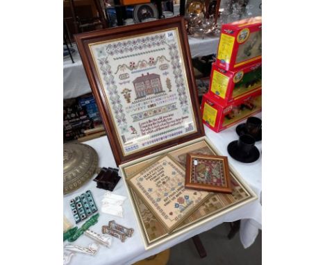 A large framed sampler dated 2004 and 3 others.
