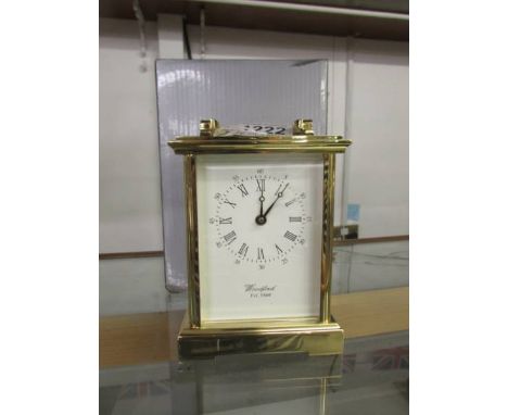 A boxed Woodford brass carriage clock.