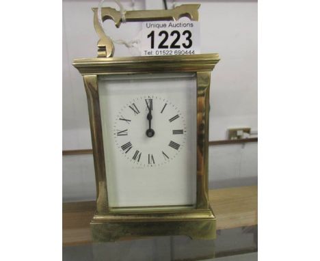 A brass carriage clock.