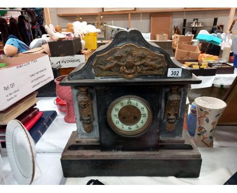 A large black slate mantle clock with brass ormolu embellishments, no key, no pendulum, no movement or springs