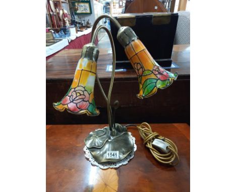 A bronzed white metal lily pad Tiffany style lamp.