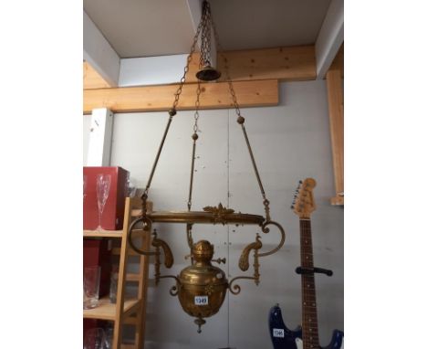 A large brass hanging oil lamp, decorated with Peacocks. Collect Only.