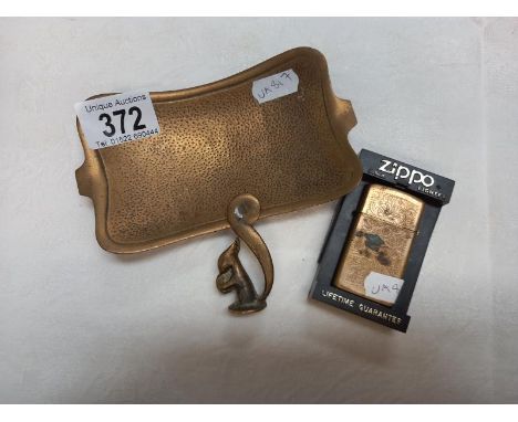 A brass Zippo light dedicated to 'MUM' and a pipe tamper in the form of a squirrel and an Israeli ashtray.