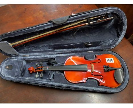 A Stagg violin in soft case. Length 28cm.