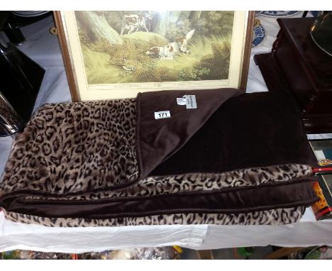 A velvet backed animal print throw by Helene Buran, London. Approximately 138cm x 178cm