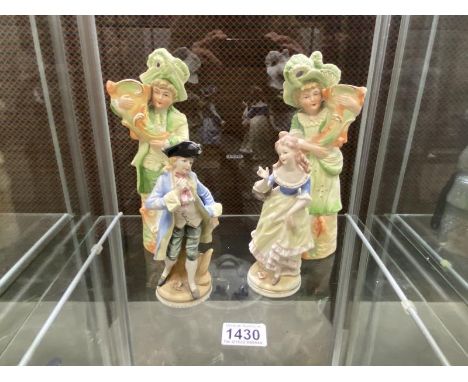 Two pairs of Bisque porcelain figures.