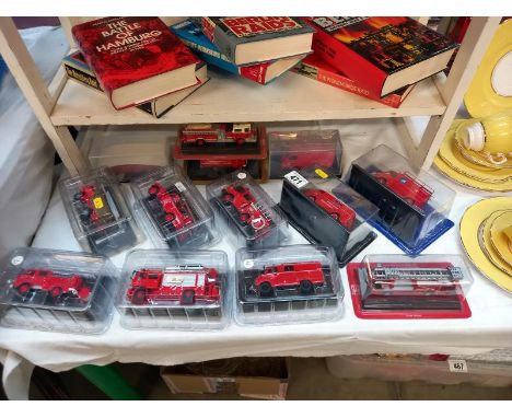 A quantity of Diecast fire engine models in original packaging by various makers.