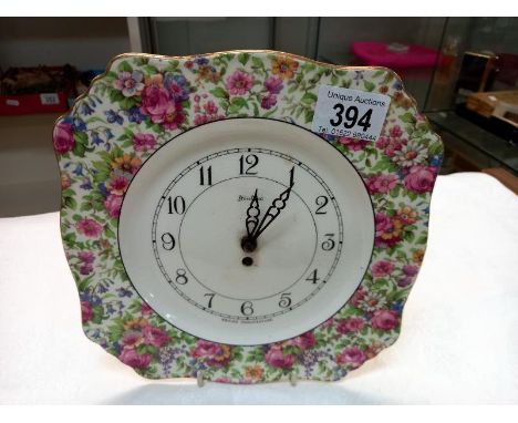 A vintage floral pattern Bentima pottery wall clock.