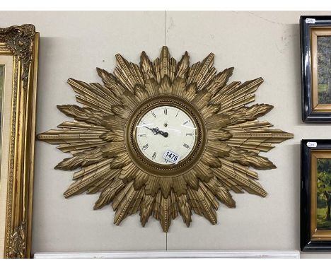 A large Smiths 8 day Sunburst clock. 66.5cm x 48.5cm.